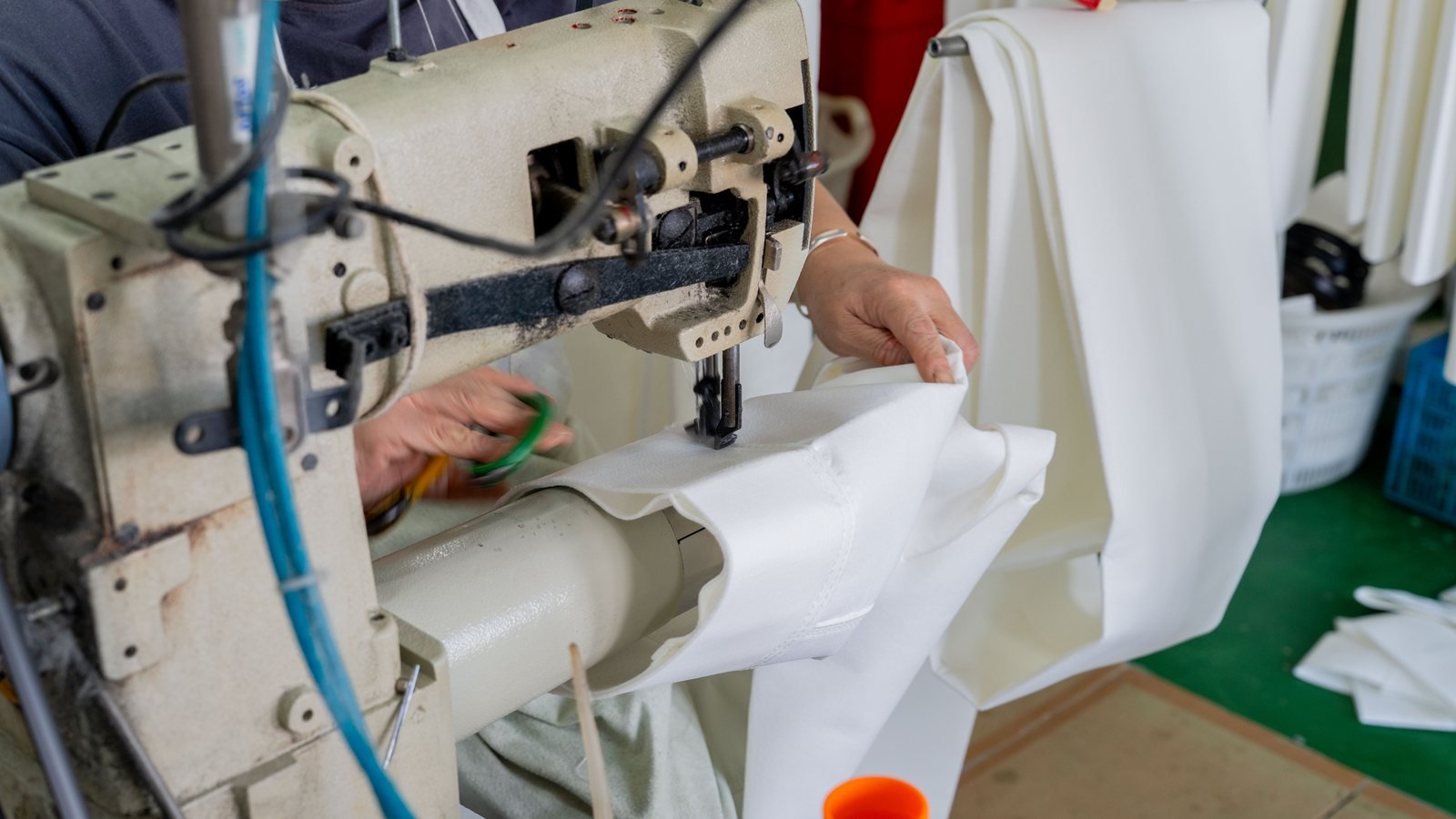 Close-up of filter bag seam sewing in the Aramid factory