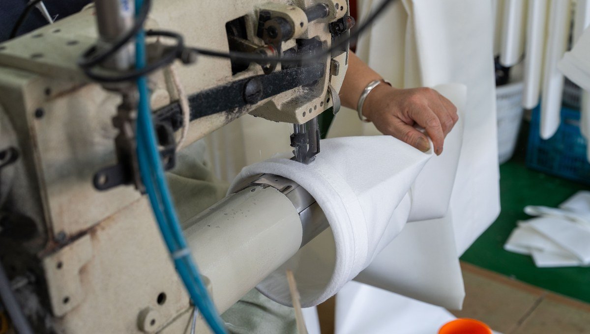 FMS filter bag seam construction and reinforcement checked during sewing.
