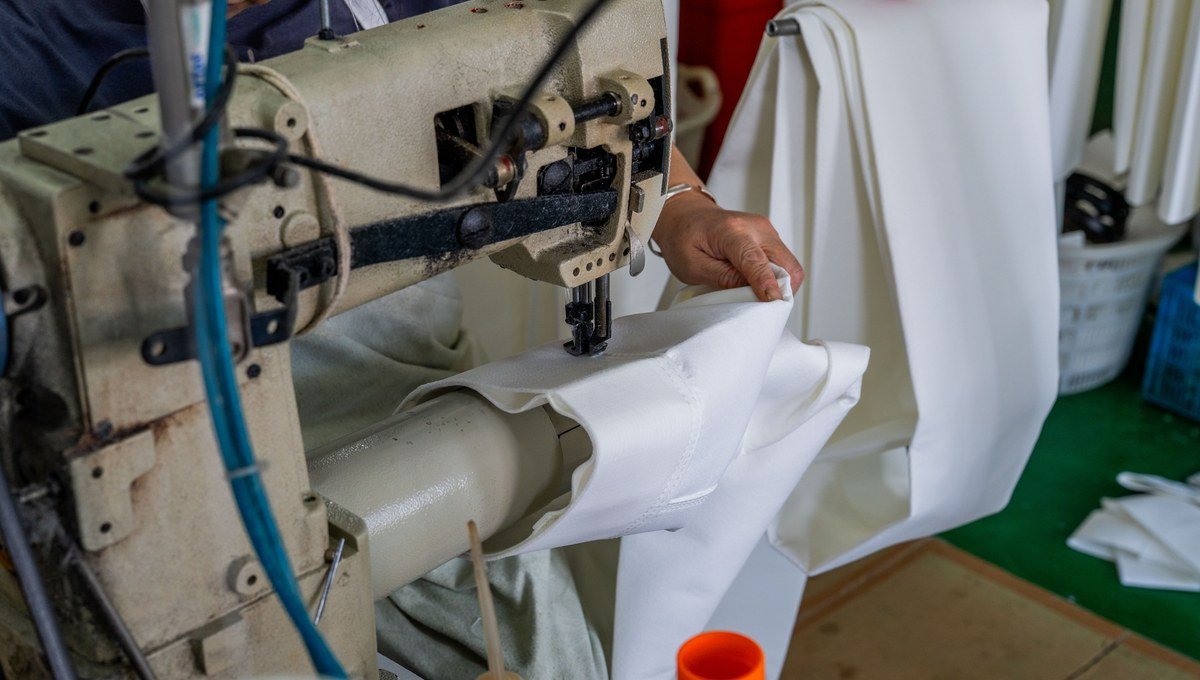 Close-up review of P84 filter bag seam construction.