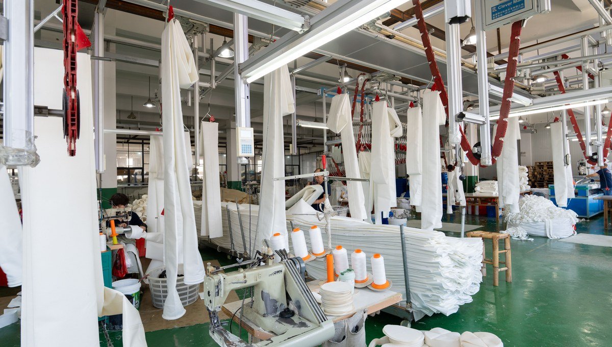Polyester filter bag sewing workshop for standard and custom dimensions.
