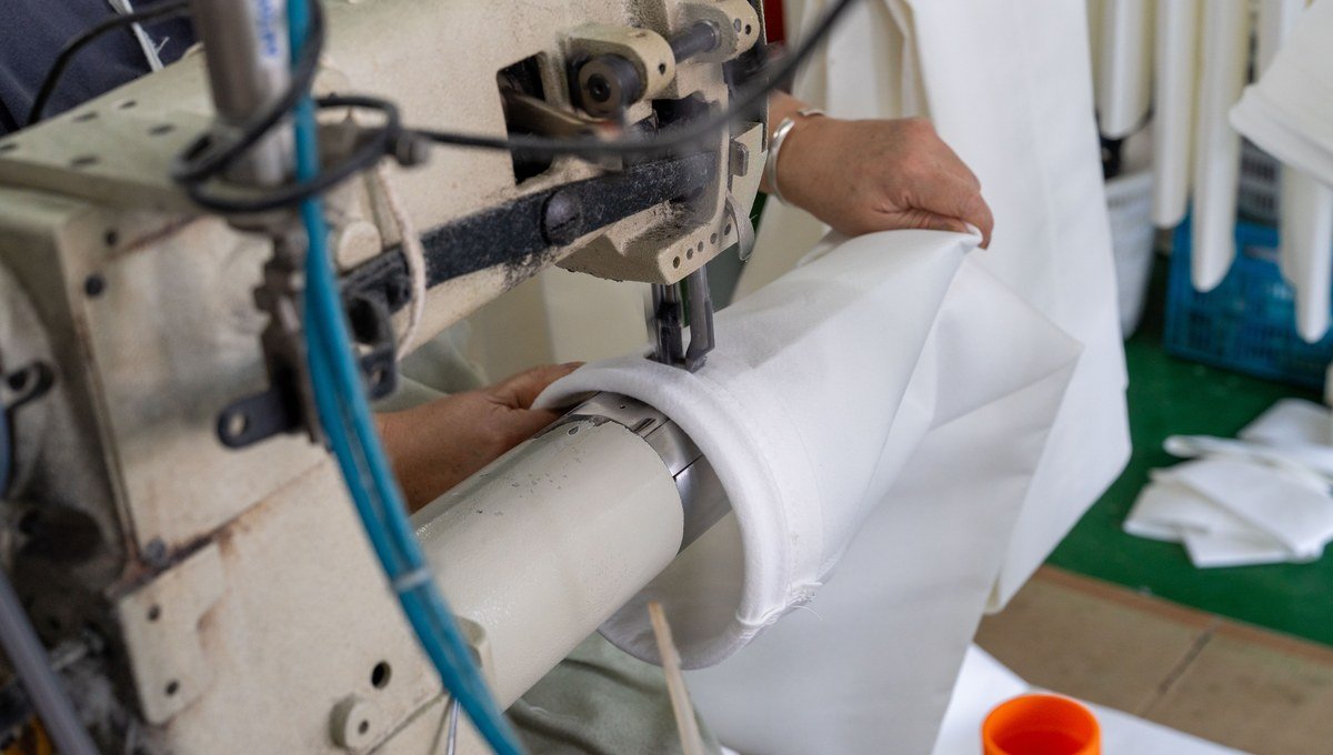 Polyester filter bag seam sewing and reinforcement detail.