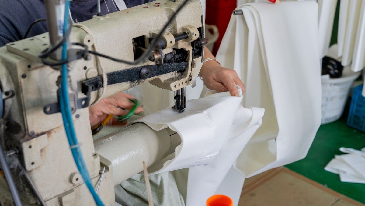 PPS filter bag seam and reinforcement detail during sewing.