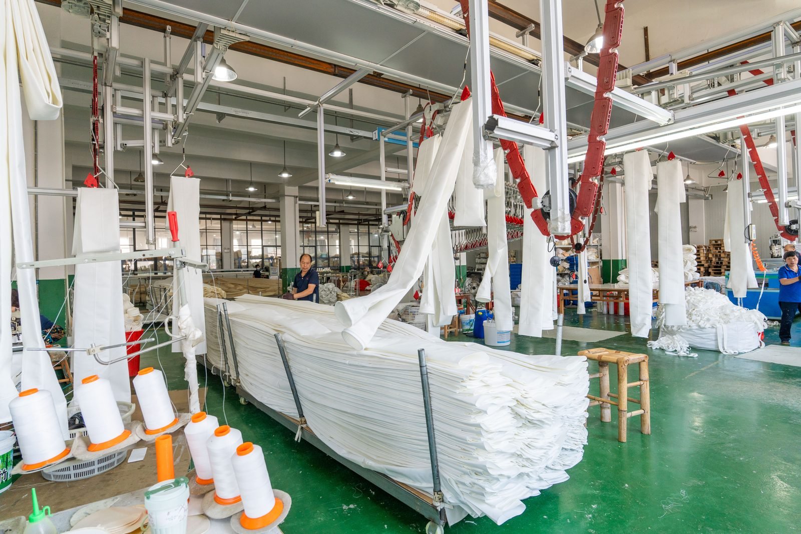 Bag sewing workshop for industrial baghouse filter bag orders.