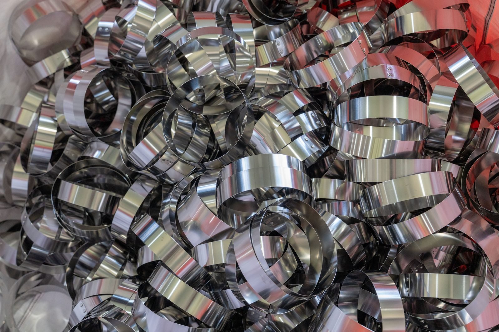 Top rings and hardware prepared for matched bag construction.