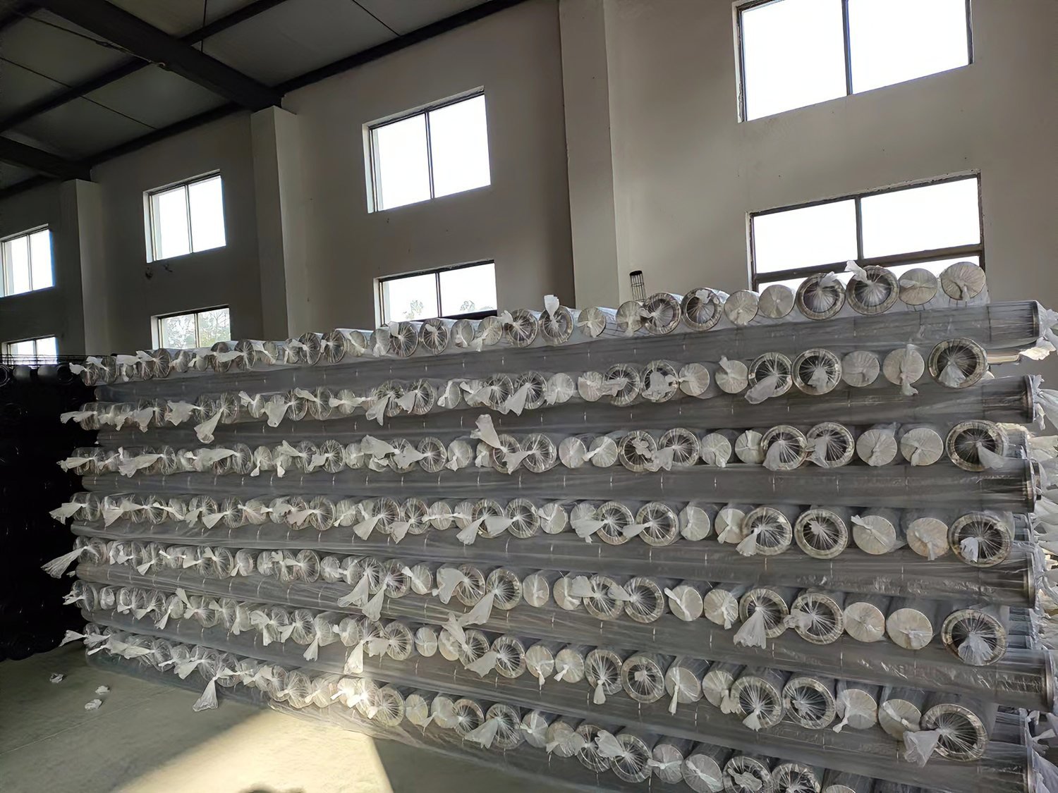 Clear finished filter cages grouped in factory stock
