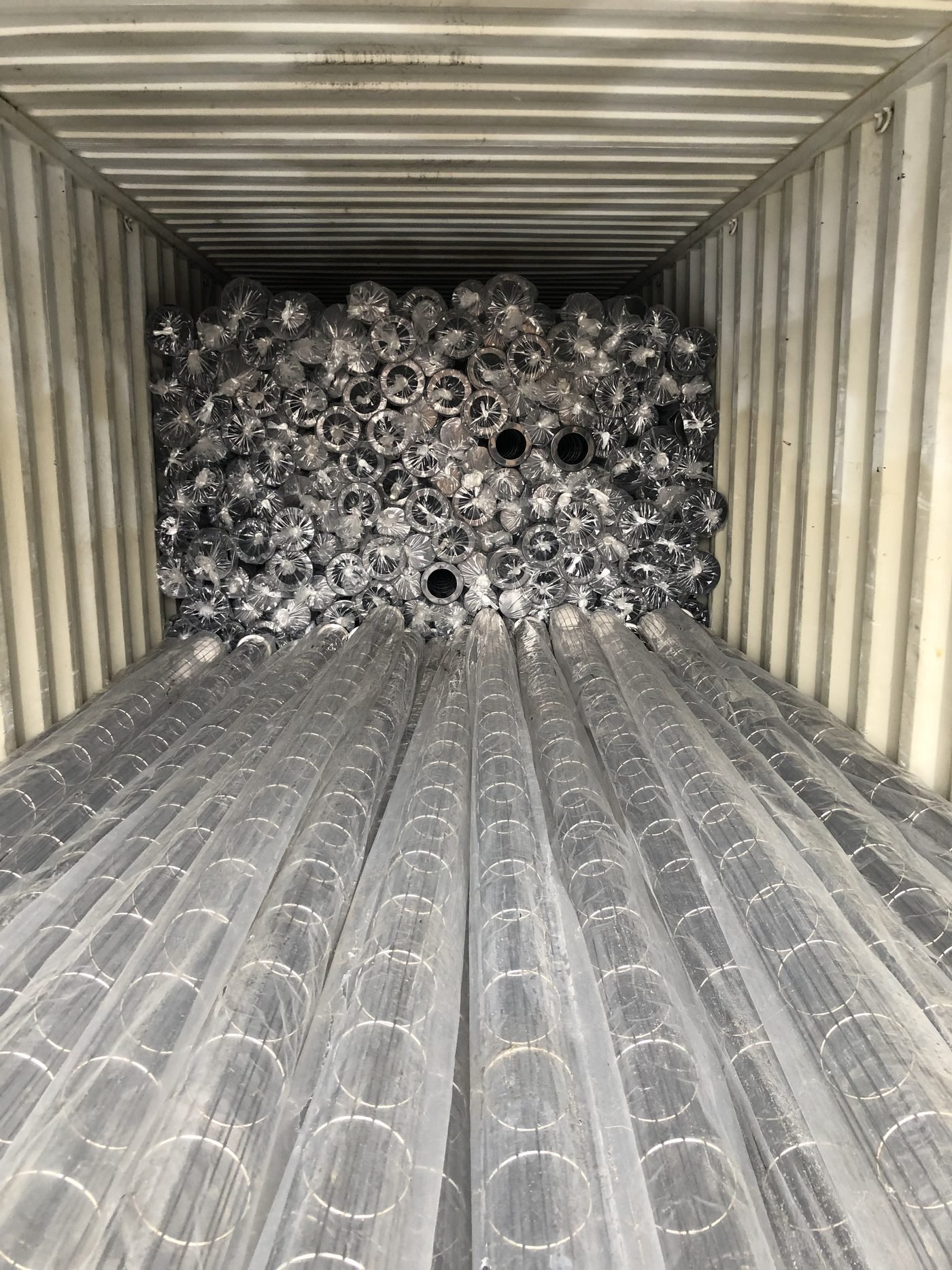 Filter cages protected and loaded in container for export shipment