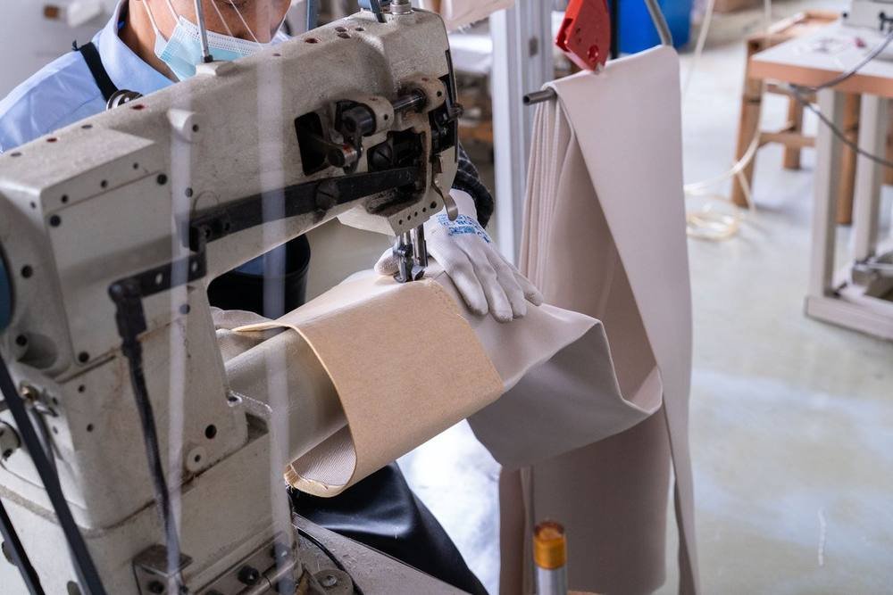 Manual sewing for filter bag top and bottom details