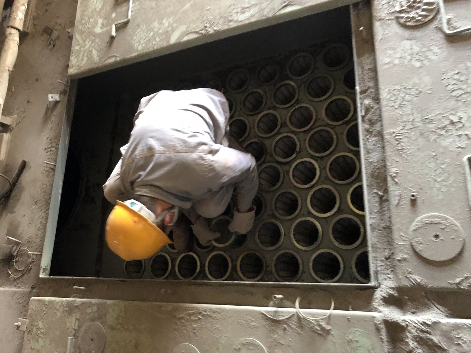 Baghouse tube sheet inspection during a cement plant filter bag maintenance visit