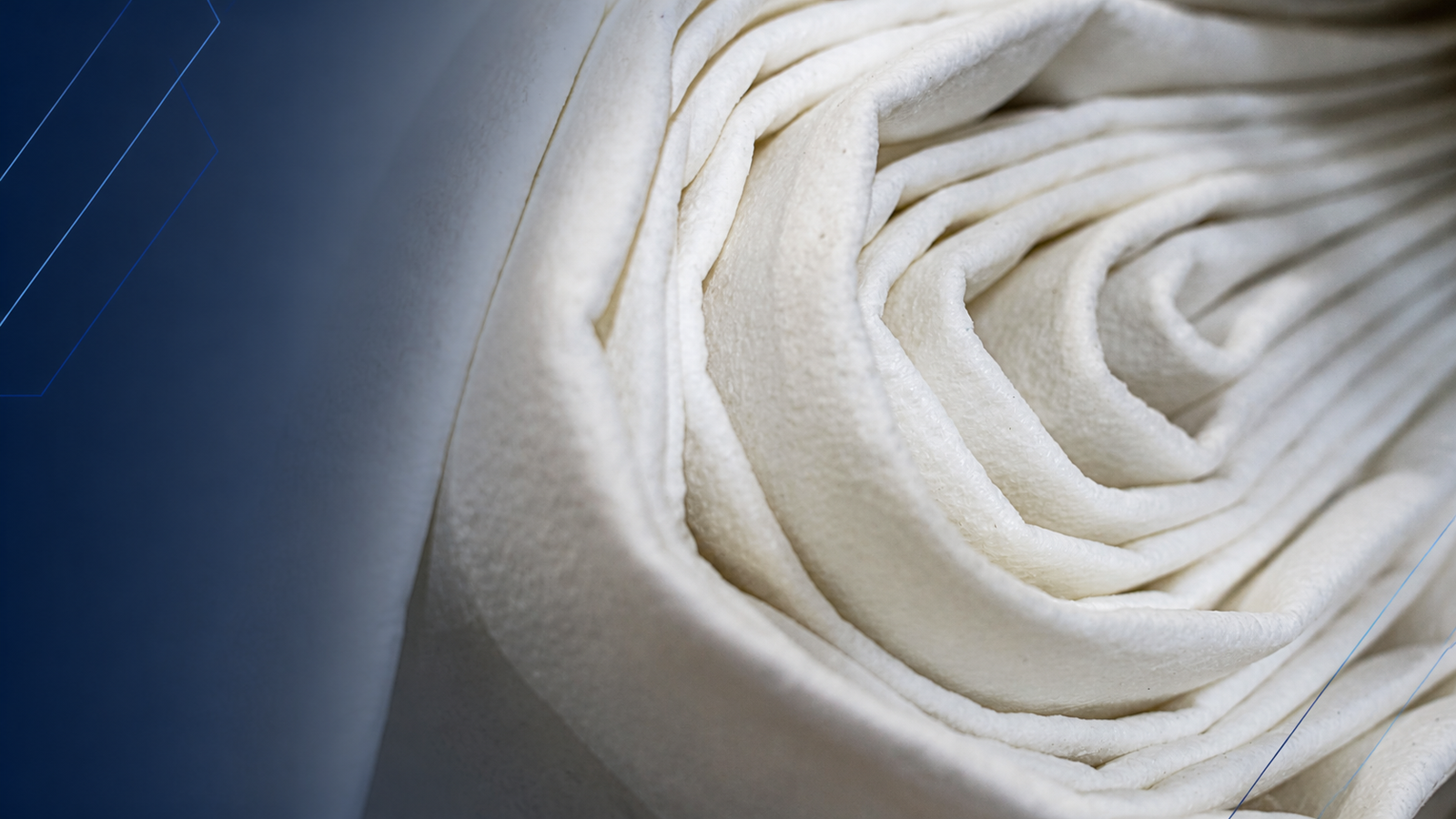 Rolled white filter media for dust collector filter bag material selection