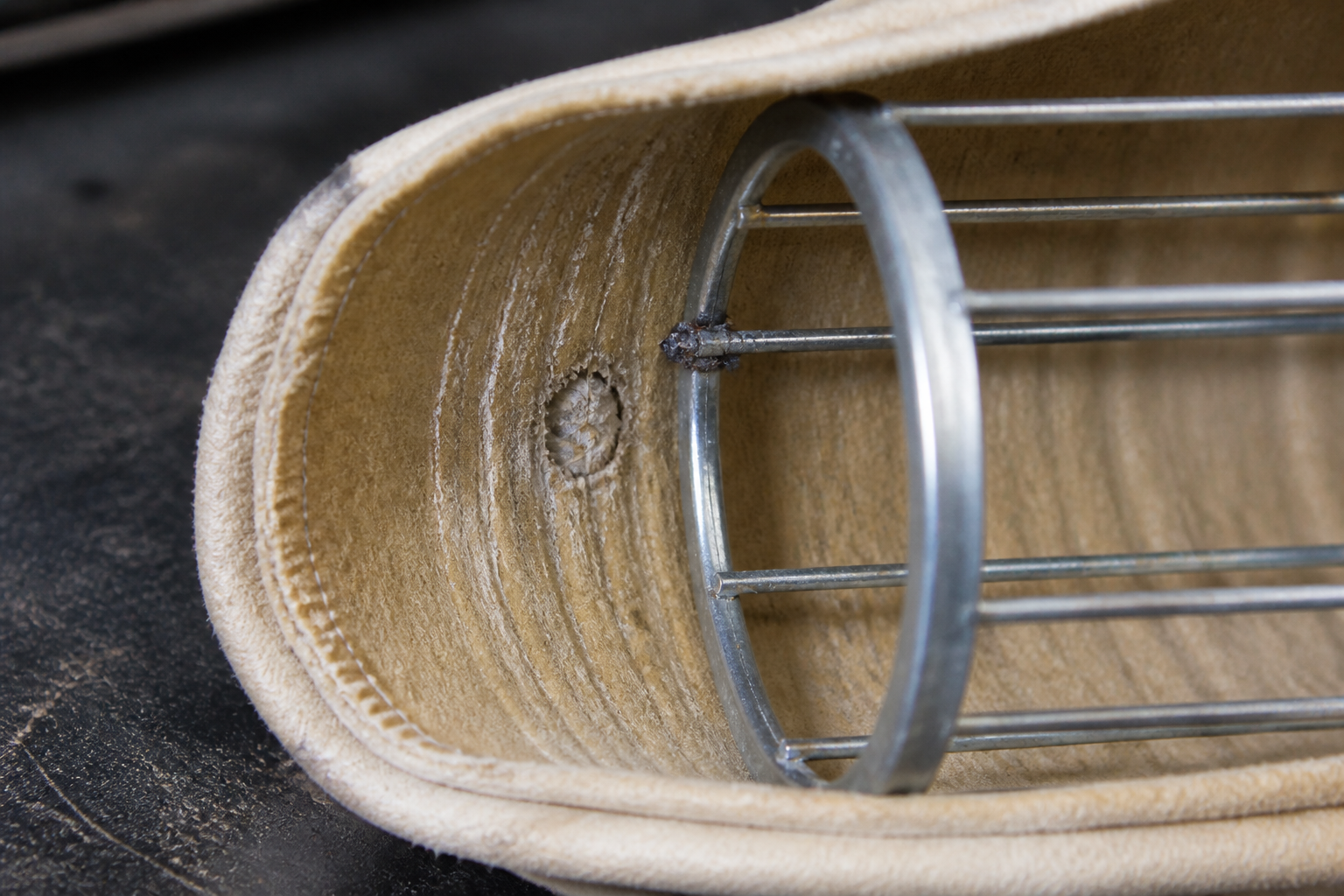 Filter bag inner surface worn at a rough filter cage contact point
