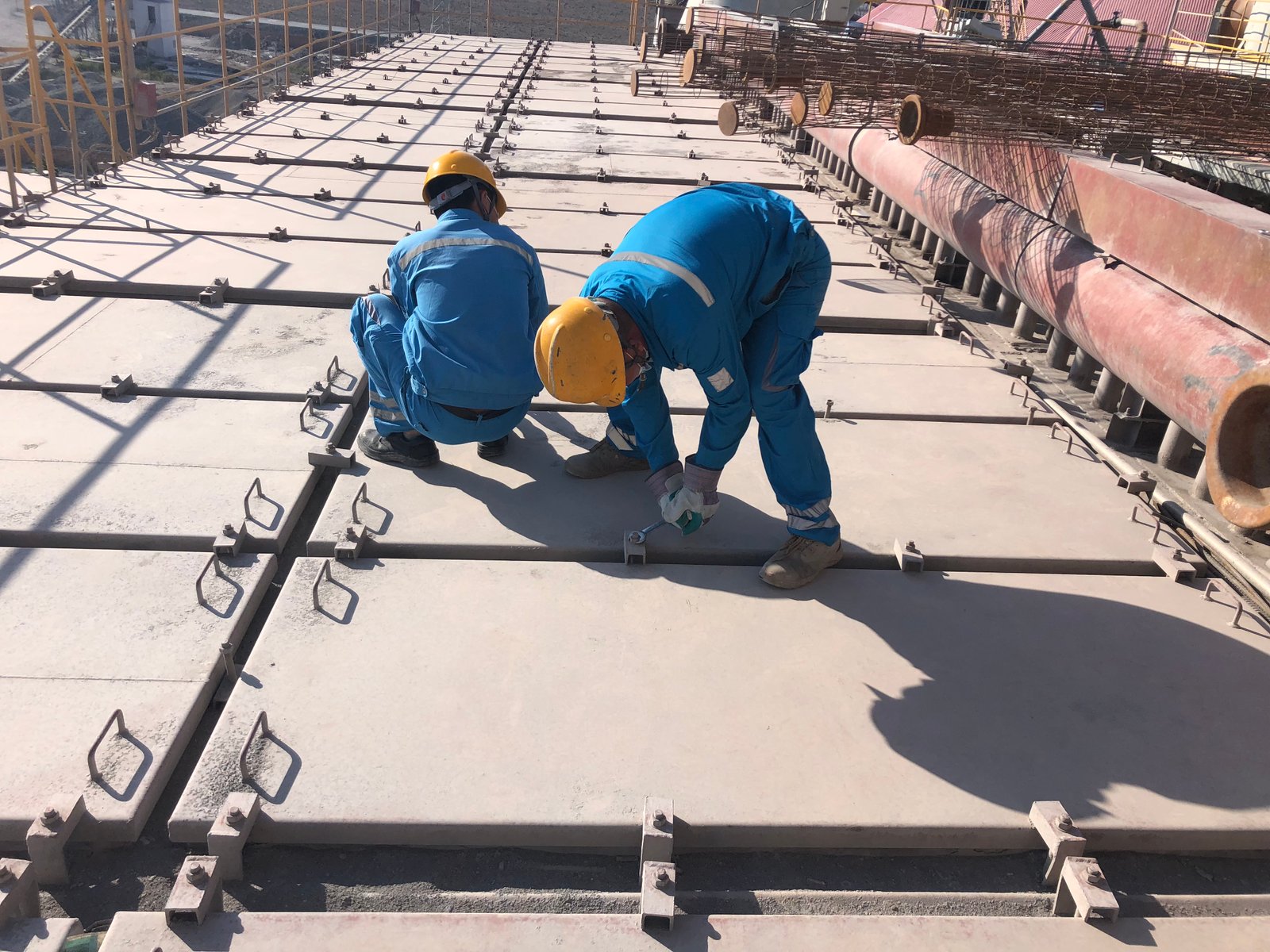 Technicians carrying out a shutdown inspection on a baghouse roof