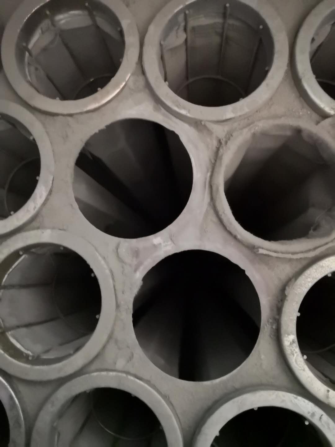Actual tube-sheet openings with damaged edges marked