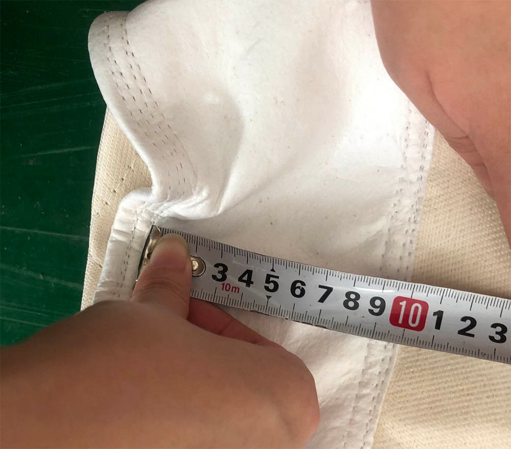 Measuring an industrial filter bag opening before final review