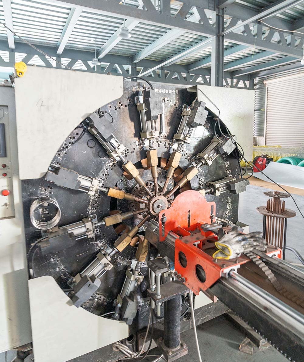 Filter cage forming machine with welding stations in the Pinnacle Filter factory